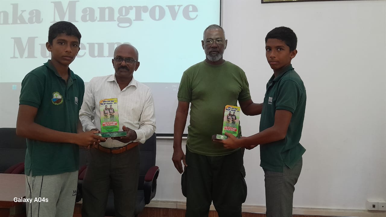 A special event was held at the Lanka Mangrove Museum to honor Nethsara and Pehesara, two members of the “Together With Mangroves” Children and Youth Environmental Society, for their outstanding achievement in sports. The duo proudly secured 5th place in the 100x4 relay event at the All Island School Games. In recognition of their accomplishment, they were presented with plaques by the museum staff. This celebration highlighted the Museum’s commitment to encouraging the holistic development of its young members—promoting both environmental stewardship and personal excellence in various fields.